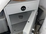 an image of an open safe box in a bathroom