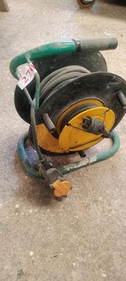 a hose that is sitting on the ground next to a hose
