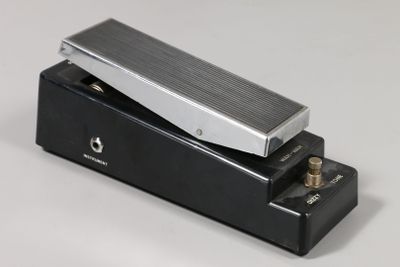 an electric guitar pedal sitting on top of a black box