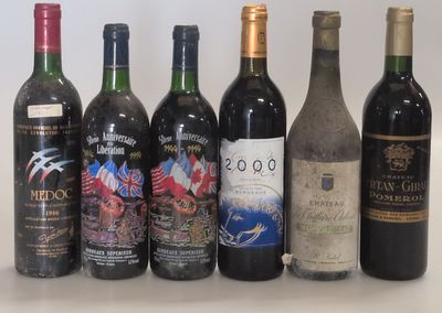 several bottles of wine are lined up on a table