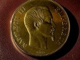 a close up of a coin sitting on top of a brown bag