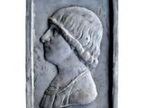 a close up of a sculpture of a woman with a headband