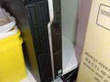 a computer sitting on top of a stack of boxes