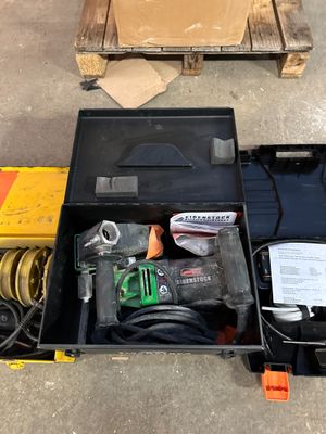 a tool box with tools in it sitting on the floor