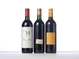 three bottles of wine are lined up on a table