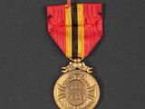a close up of a medal on a black surface