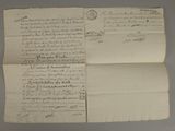 an old document with writing on it sitting on top of a table