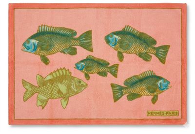 a picture of a rug with fish on it