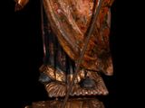 an image of a statue of a man holding a staff