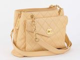 beige quilted purse with gold hardware and chain strap