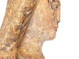 statue of a woman with a veil on her head and a white background