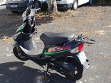 a scooter that is parked in the parking lot