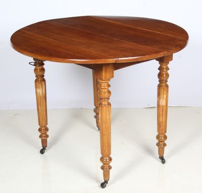 an image of a wooden table with wheels on a white floor