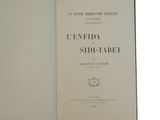 an open book with a black and white image on it