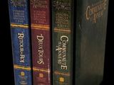 three books that are stacked on top of each other