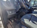 a view of the inside of a van with the steering wheel down