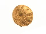 l'image d'une pièce d'or sur laquelle figure le visage d'une femme