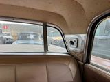 a view of the inside of a car from the passenger seat