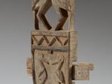an image of a sculpture of a man and woman on a shield