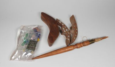 a pair of shoes, a pen, and a bag on a table