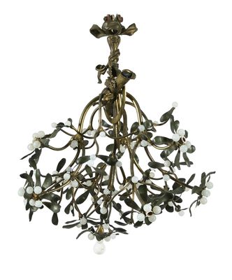 a brass chandelier with flowers and leaves hanging from the ceiling