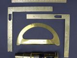 an image of a set of tools that include a ruler, a measuring scale, and a caliper