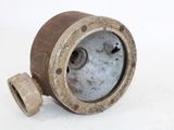 a small metal object that is sitting on a white surface