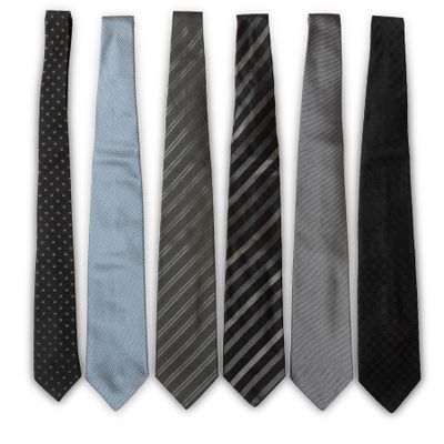 six different ties are lined up in a row on a white background