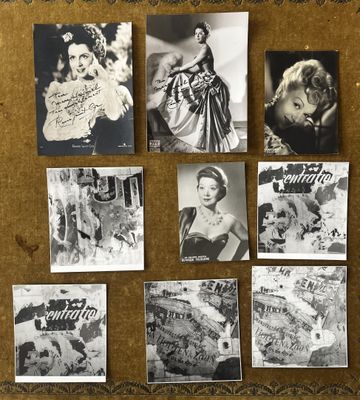 black and white photograph of a bulletin board with pictures of women on it