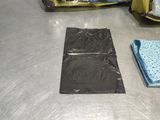 a piece of luggage sitting on a table next to other items