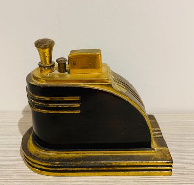 a black and gold model of a train on a table
