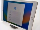 an image of a tablet computer sitting on top of a white table