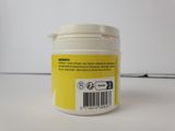 a jar of pills sitting on a table with a barcode on it