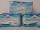 three packs of tenx sanitary pads sitting on top of each other