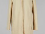 an image of a beige coat on a mannequin mannequin