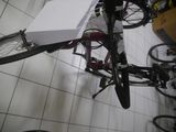 a bicycle that is hanging from the ceiling in a room