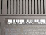 a close up of a laptop with a barcode on it