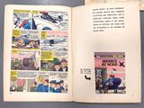 an open comic book with a picture of a plane and a comic strip