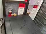 a metal table with a sign that says patisseries on it
