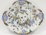 an image of a decorative plate with birds and flowers on it
