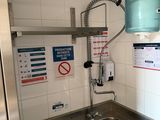 a sink and a faucet in a small room