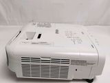 an image of a projector sitting on top of a white table