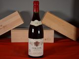 a bottle of wine that is sitting on a table