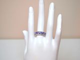 a white hand with a ring on top of it