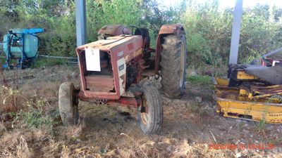 a tractor that is sitting in the dirt