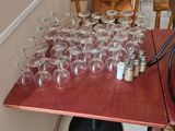 many empty wine glasses sitting on a table in a restaurant