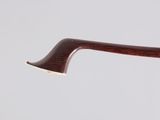 a close up of a pipe with a wooden handle on a white background
