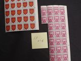 two stamps and a postcard on a table with a note