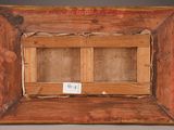 an old picture of a wooden frame with a label on it