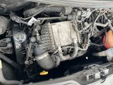 a close up of a car ' s engine with the hood open